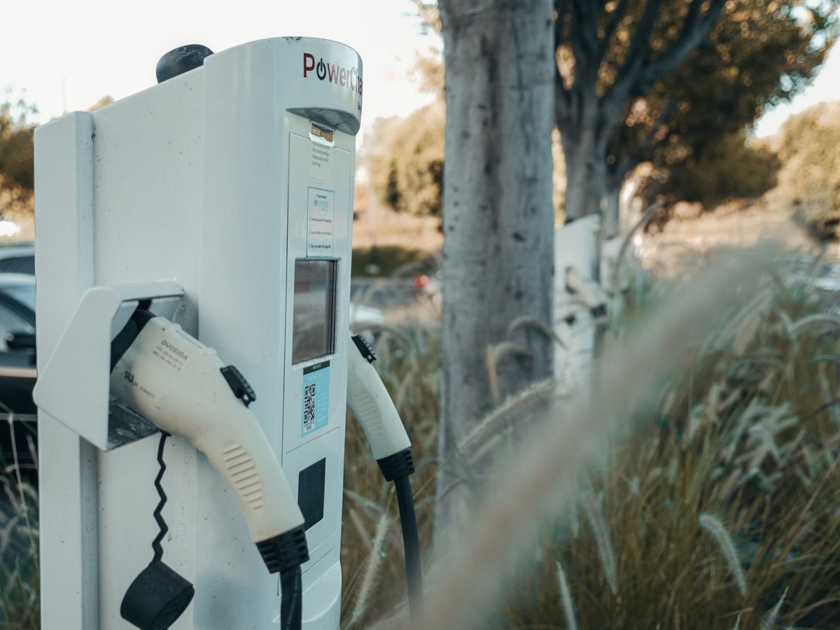 Electric vehicle being charged at a modern charging station